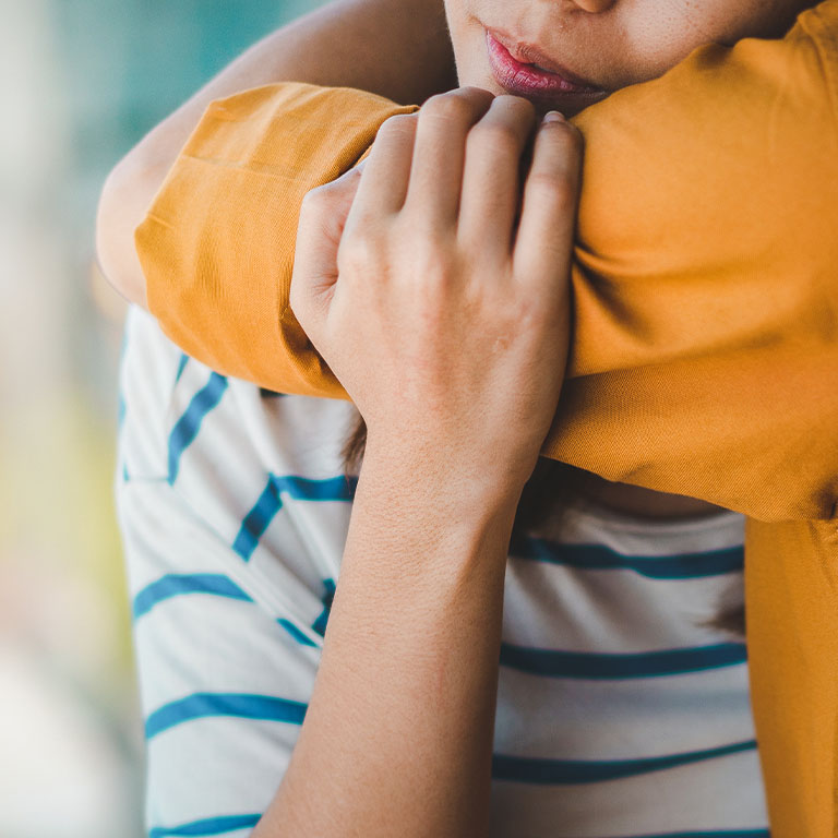 A closeup of a hug