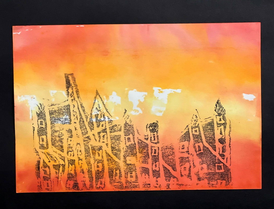 An art piece of a dark gray cityscape at sunset.