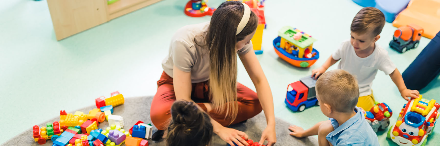 A teacher playing with her students